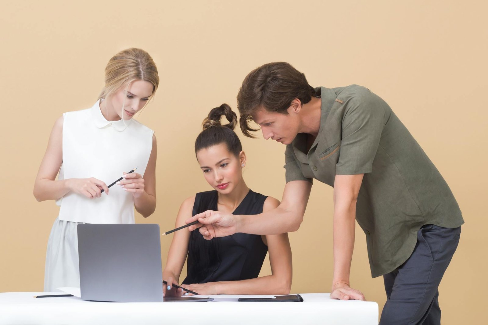 Photo by Moose Photos on <a href="https://www.pexels.com/photo/colleagues-looking-at-laptop-1036641/" rel="nofollow">Pexels.com</a>