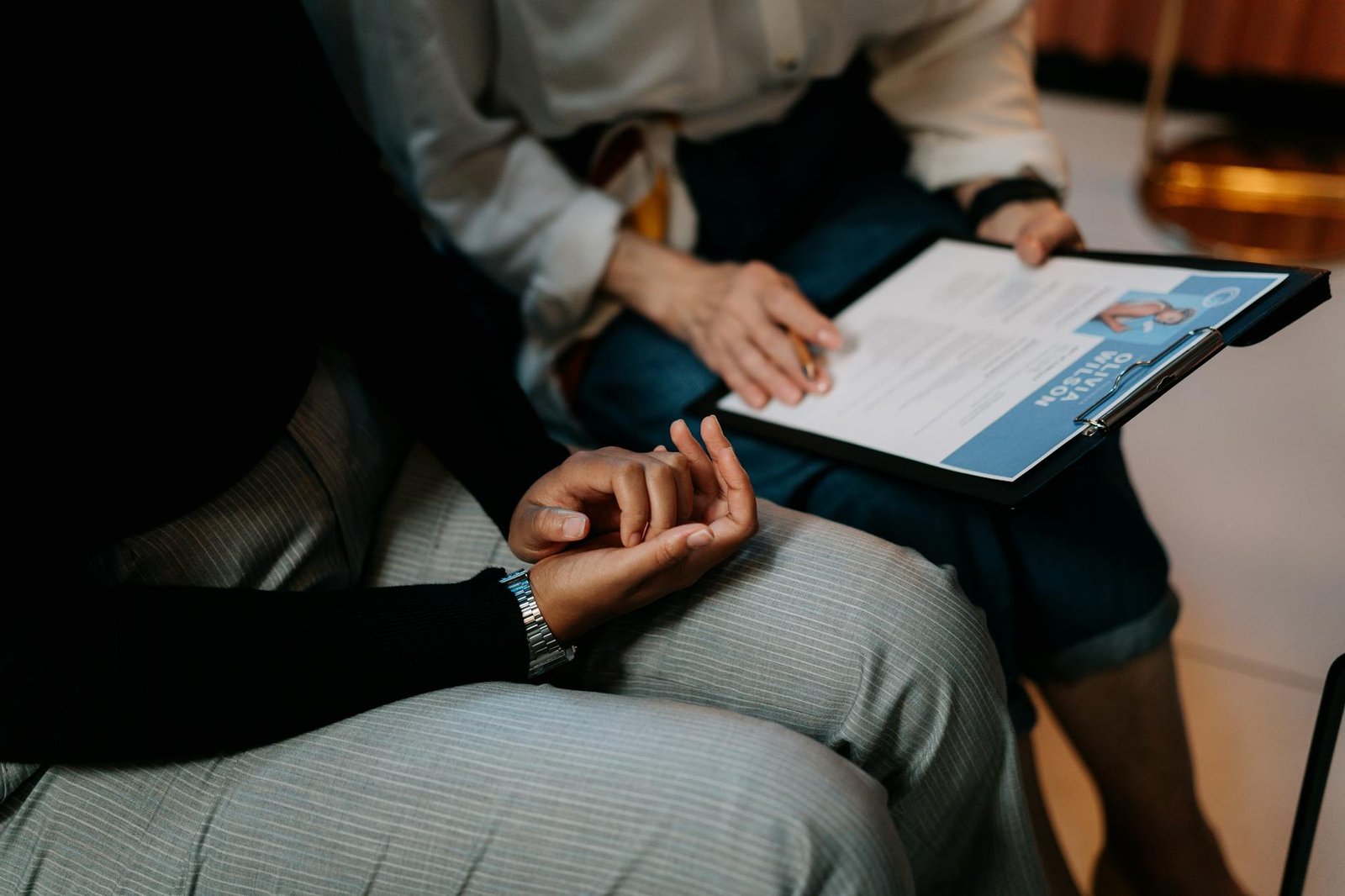 Photo by cottonbro studio on <a href="https://www.pexels.com/photo/person-in-white-long-sleeve-shirt-holding-a-clipboard-with-resume-5989933/" rel="nofollow">Pexels.com</a>