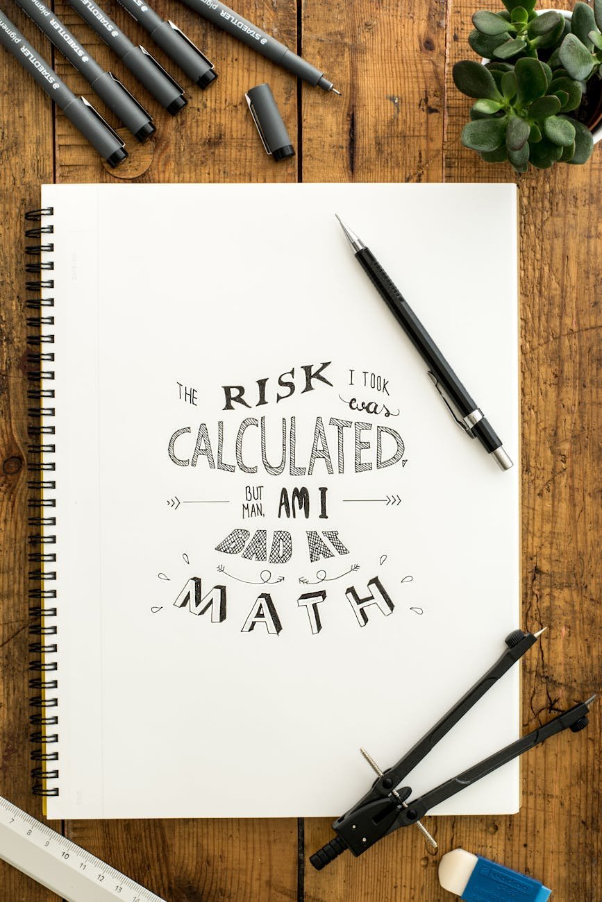 Photo by Lum3n on <a href="https://www.pexels.com/photo/flat-lay-photography-of-notebook-pen-and-drafting-compass-616849/" rel="nofollow">Pexels.com</a>