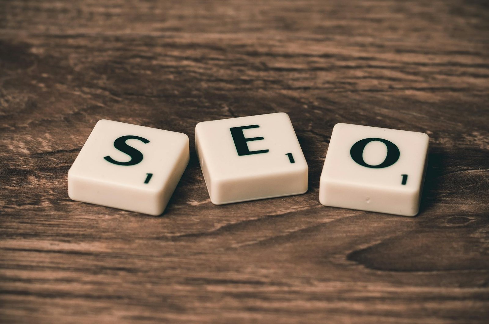 Photo by Pixabay on <a href="https://www.pexels.com/photo/three-white-and-black-scrabble-tiles-on-brown-wooden-surface-270637/" rel="nofollow">Pexels.com</a>