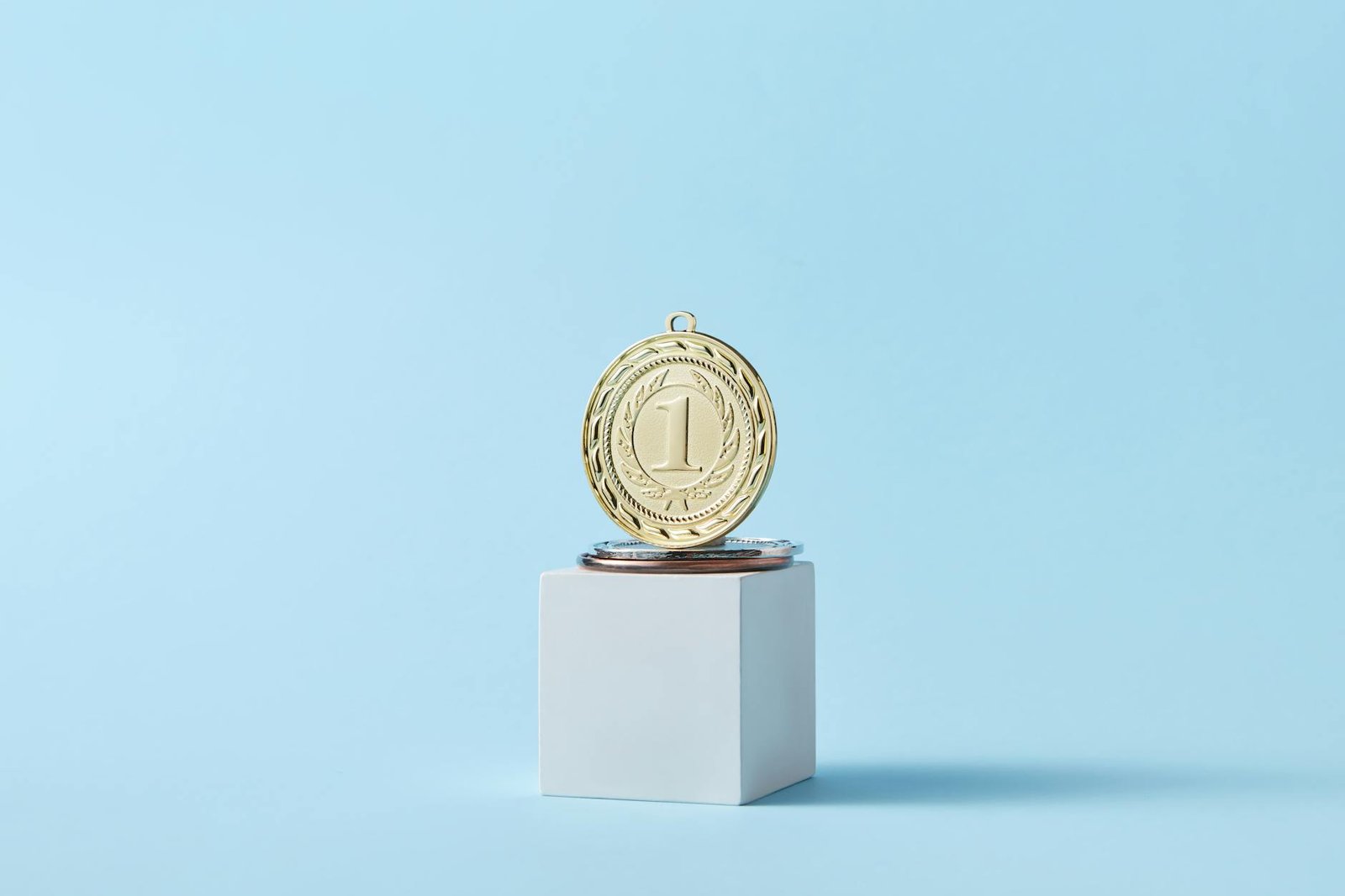 Photo by DS stories on <a href="https://www.pexels.com/photo/close-up-photo-of-a-gold-medal-7267576/" rel="nofollow">Pexels.com</a>