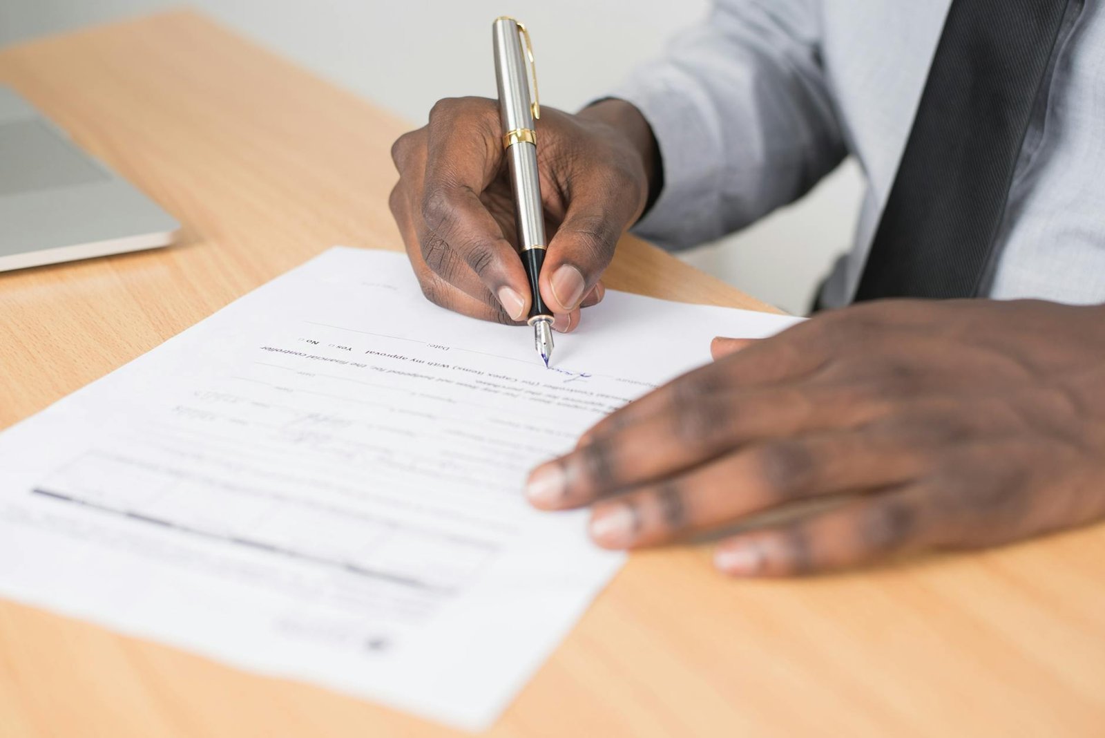 Photo by Cytonn Photography on <a href="https://www.pexels.com/photo/person-holding-gray-twist-pen-and-white-printer-paper-on-brown-wooden-table-955389/" rel="nofollow">Pexels.com</a>
